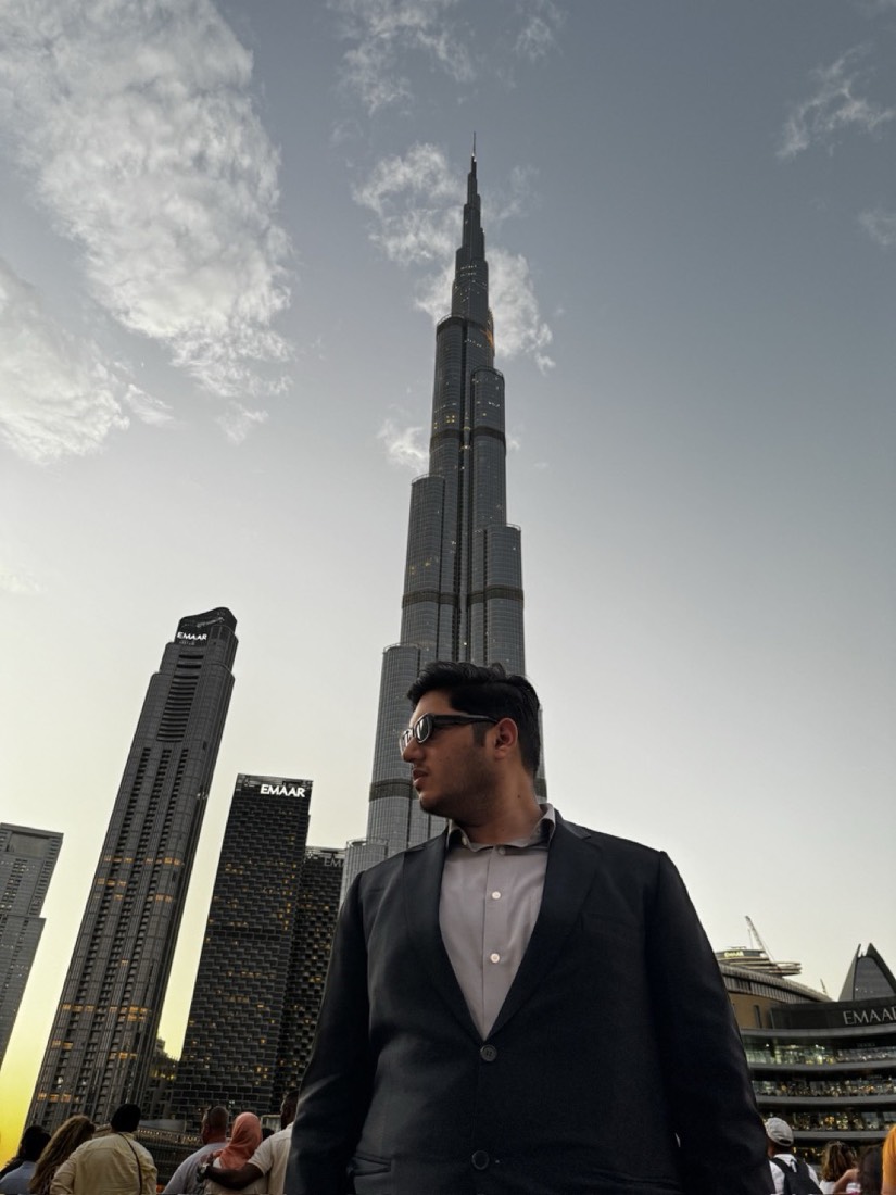 Husnain in front of the Burj Khalifa in Dubai